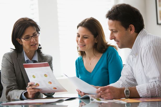 Couple-inspecting-mortgage